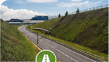 Road between two revegetated slopes